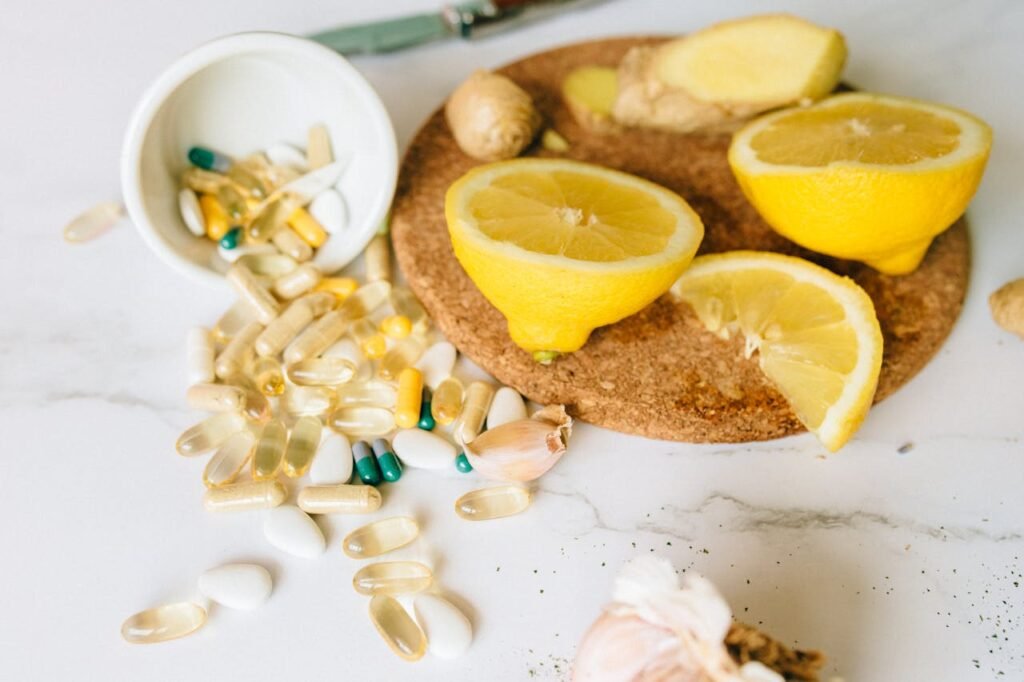 Sliced lemons and various supplements on a corkboard, symbolizing natural health remedies.